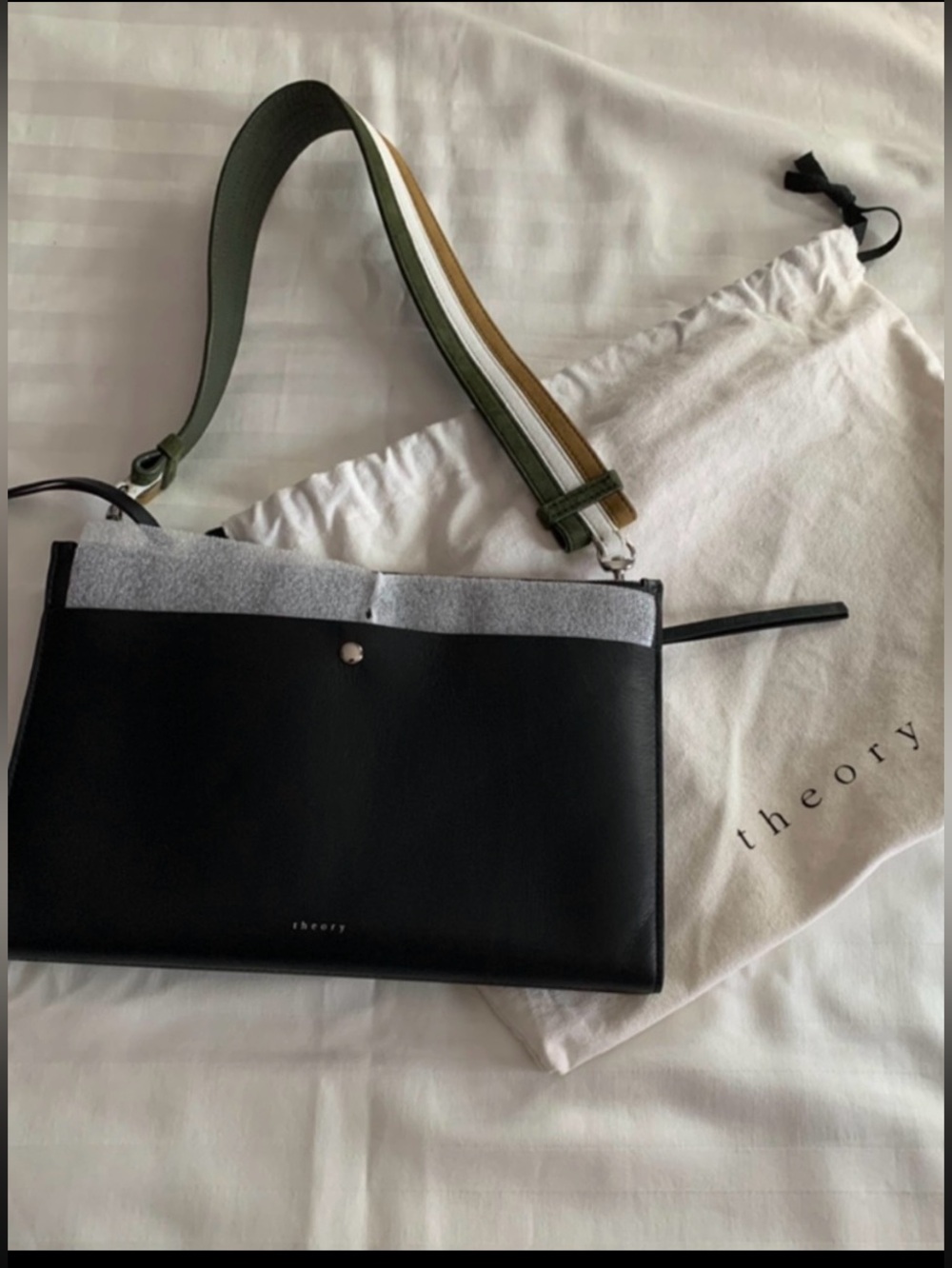 Theory Black Leather Post Clutch with Striped Strap & dust bag included